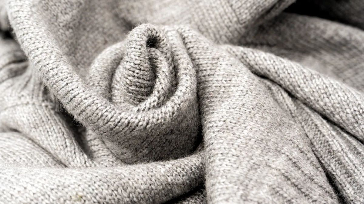 A grey mohair jumper with a springy, lofty knit that keeps its shape.